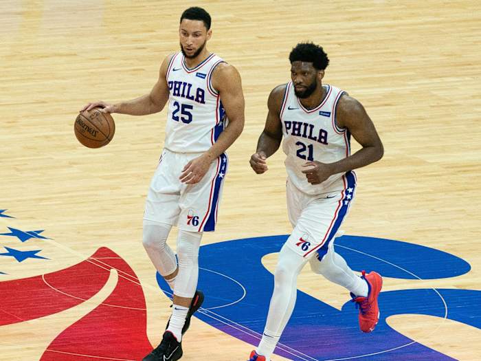 Philadelphia 76ers guard Ben Simmons (25) and center Joel Embiid (21) bring the ball up court against the Atlanta Hawks during the second quarter of game seven